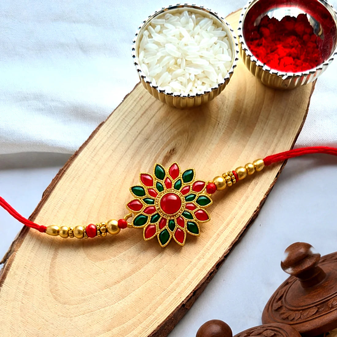 Red & Green Stone Flower Rakhi – Traditional & Elegant Gift